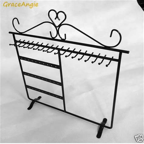 mini black embossed metal box on wrought iron stand|black metal jewelry box stand.